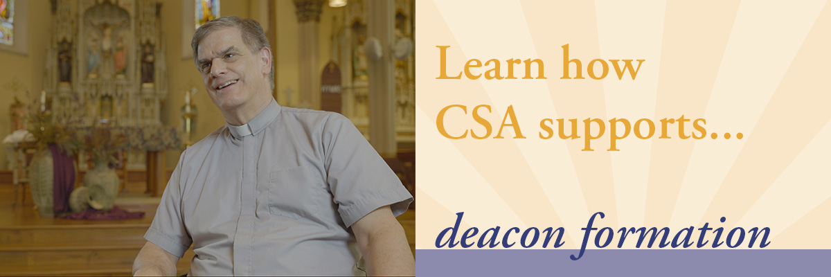 Dcn. Paul sitting in gray shirt