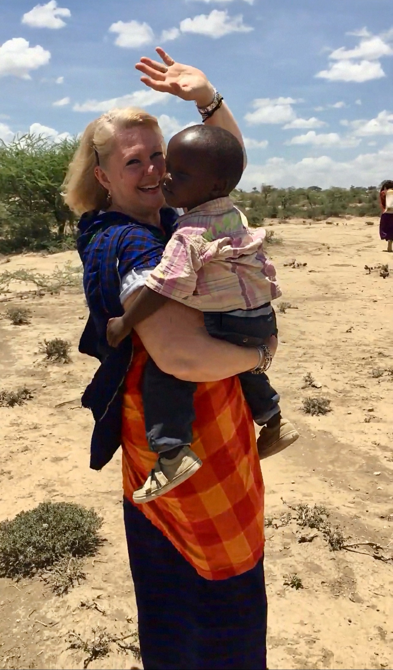Cathy with Tanzanian child