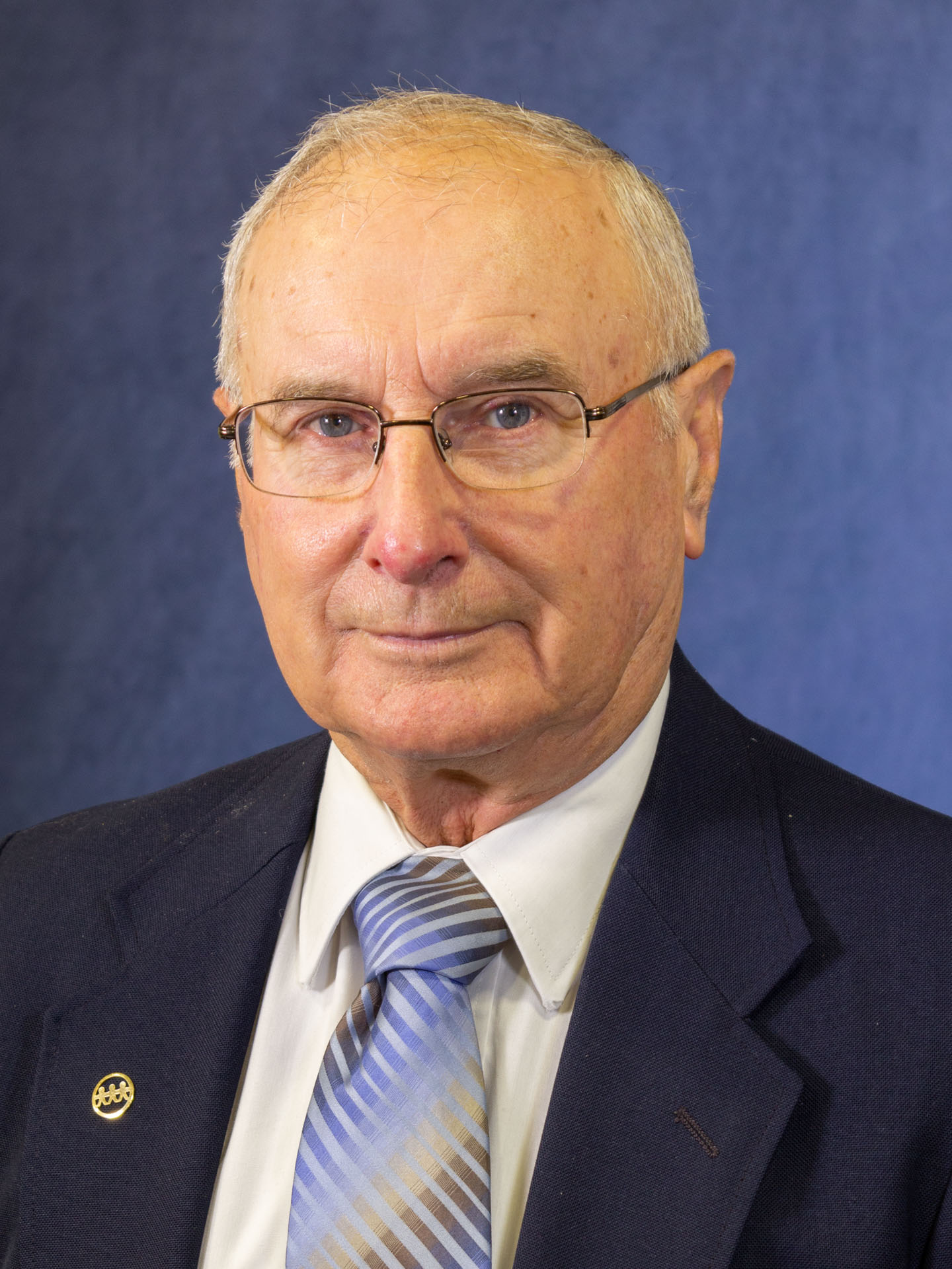 older man with glasses headshot