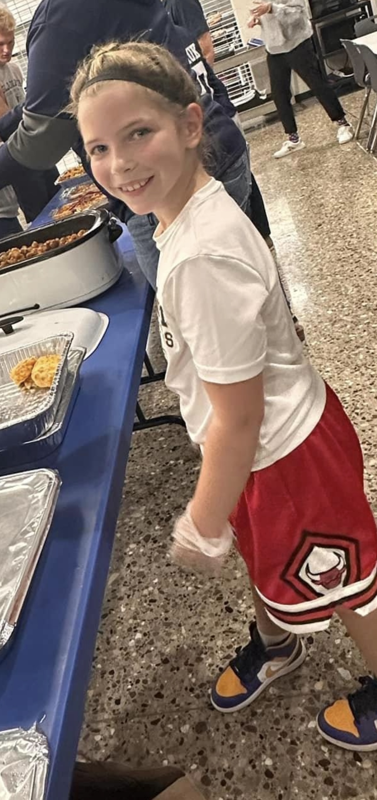 little girl serving food 