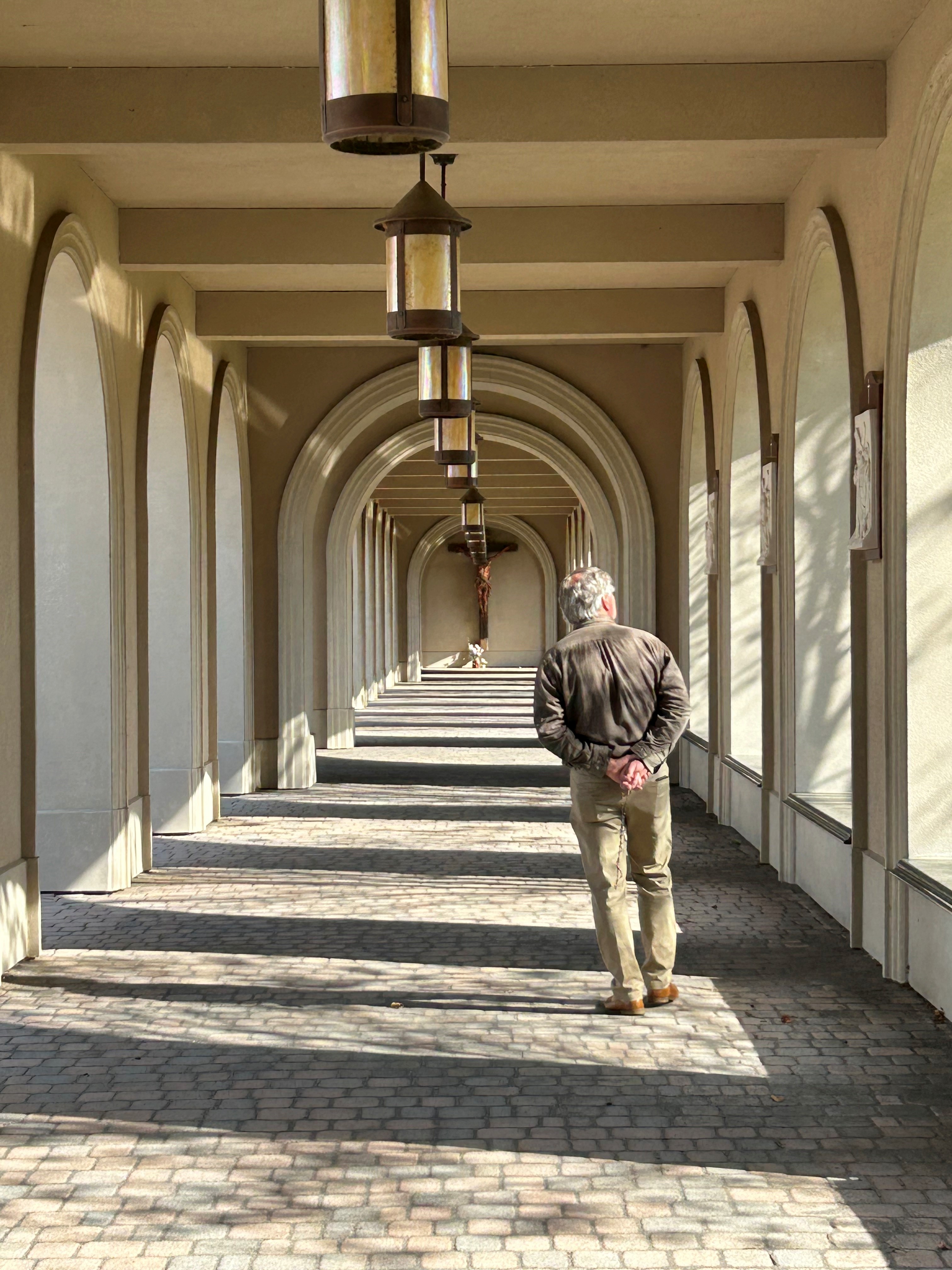 man walking in outdoor hall