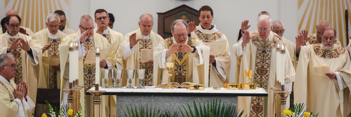 priests blessing the eucharist