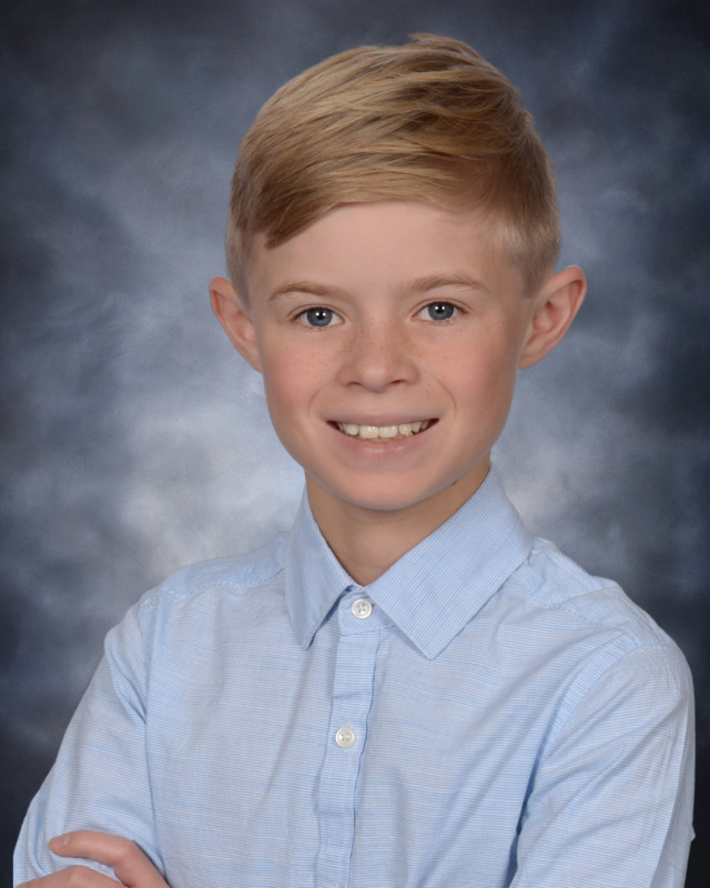 headshot of Chase Brewer. Boy wearing blue button down shirt