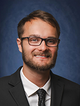 man in suit headshot