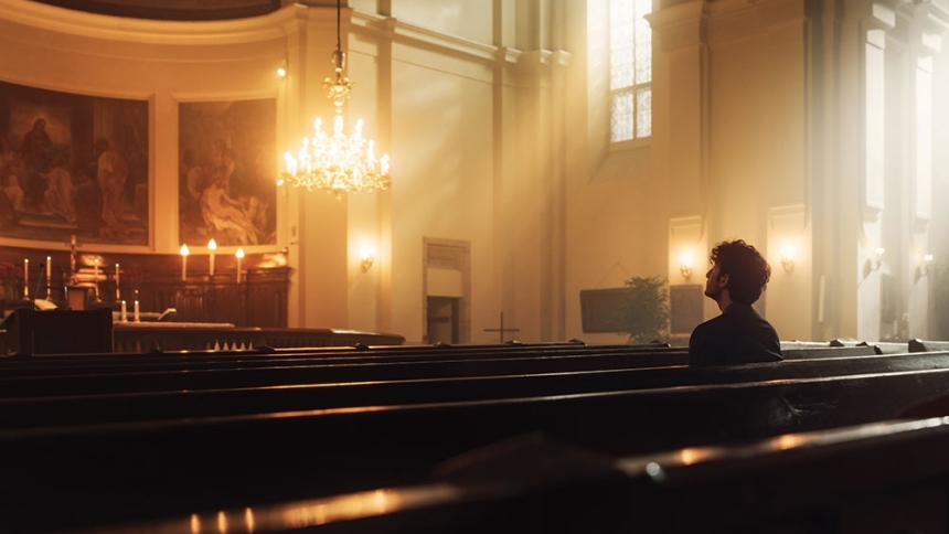 man in dim lit church