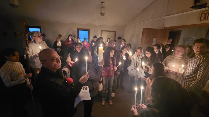 people gathered with candles