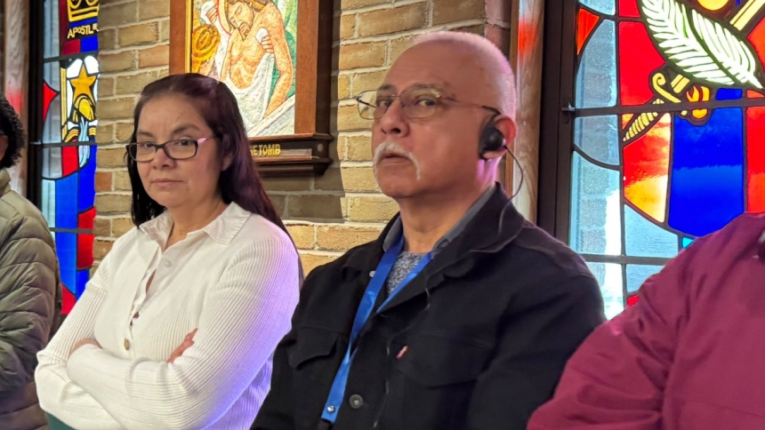 man using hearing device in cathedral