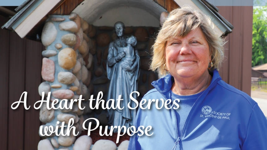 woman standing near St. Vincent de Paul statue