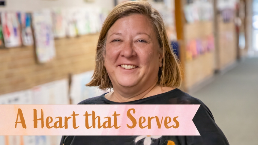 woman standing in school hallway