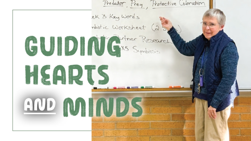 teacher standing near white board