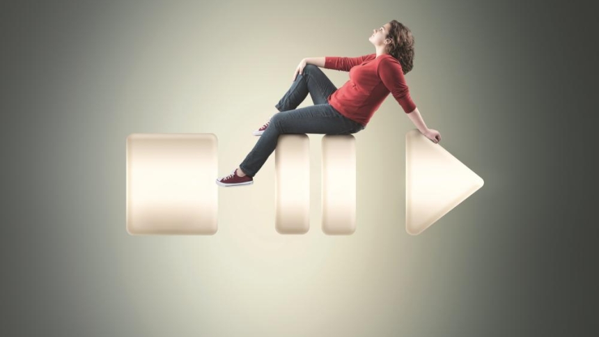 woman sitting on pause button