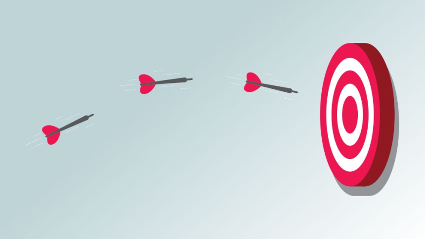 darts aimed at dartboard 