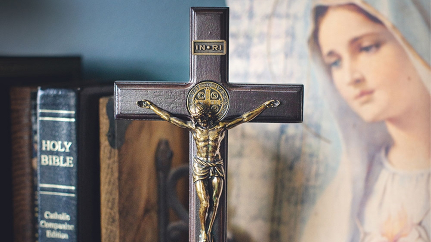 bible with cross and an image of Mary