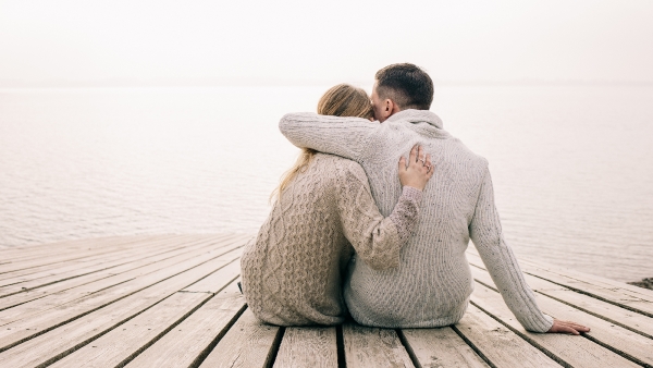 couple sitting on a dock