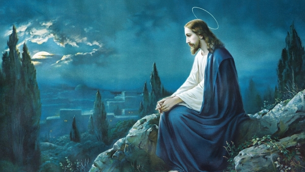 Jesus sitting with blue background